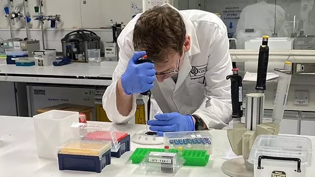 Dr John Walsby-Tickle pipetting onto a MALDI target plate